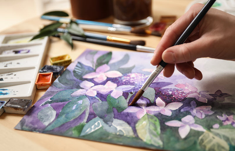 Person painting flowers